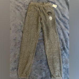 Roots classic black heather sweatpants with velvet logos.